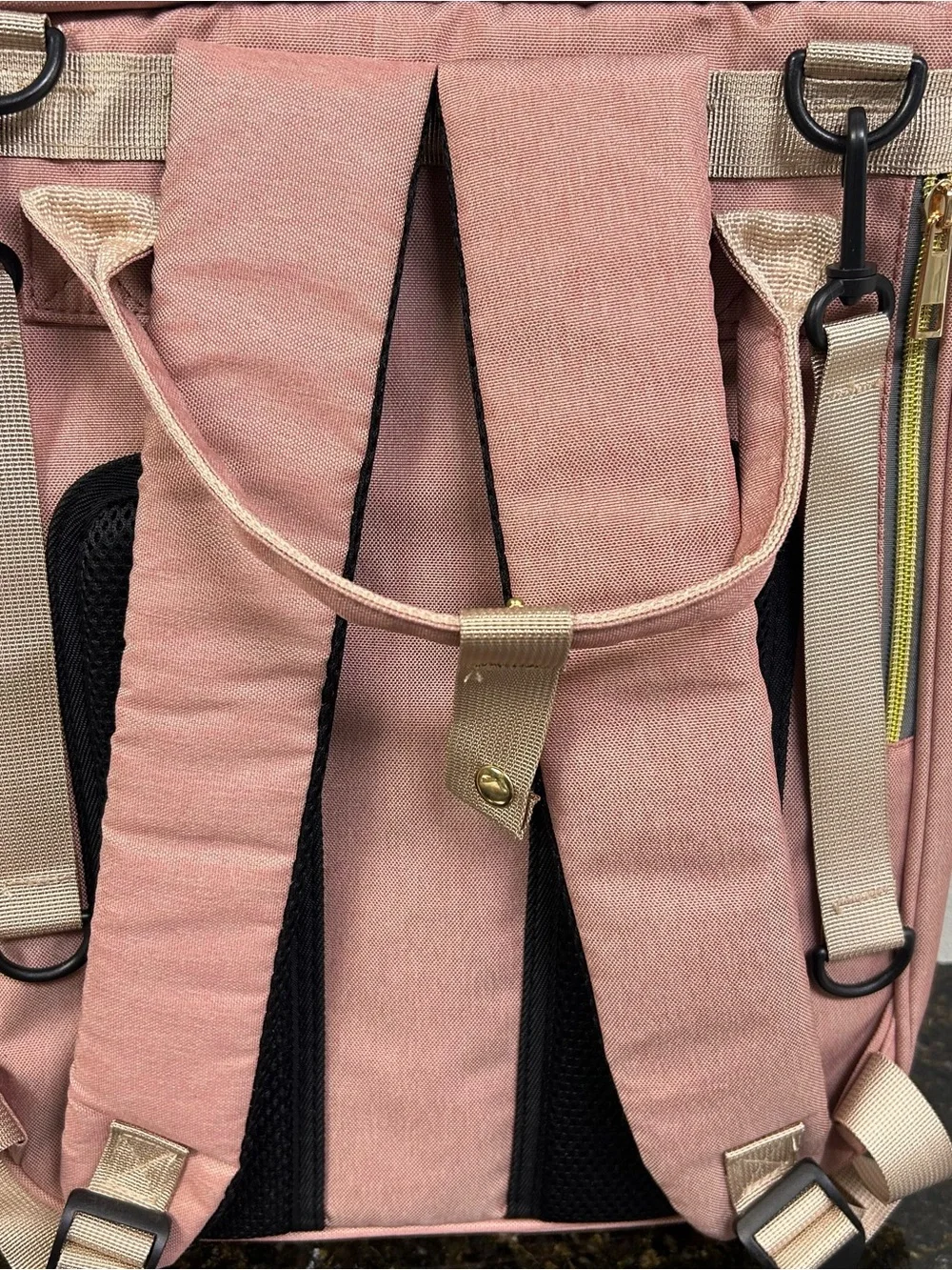 LAND Traveling Share diaper bag backpack in a pink and gray color scheme